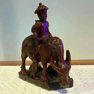 Hand Carved Wooden Fisherman On Buffalo Red Wood Sculpture